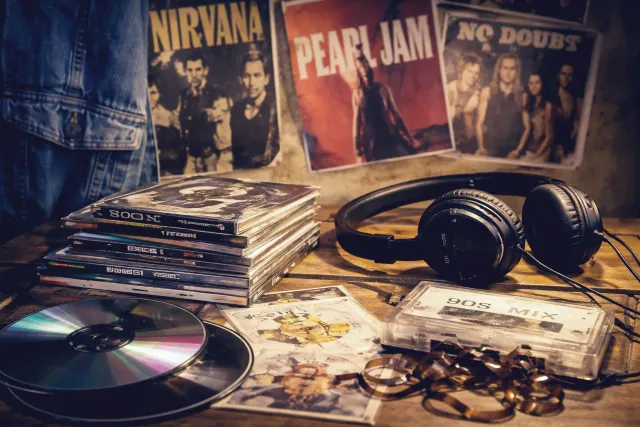 90s bands collage featuring grunge, pop groups, and Britpop icons