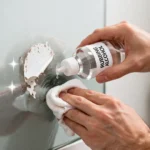 Rubbing Alcohol for Sticker Residue being used to remove sticky label glue from a glass jar